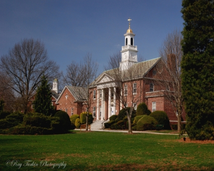 Brick school building with clock tower.