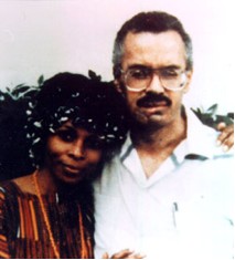 A man and woman pose for the camera.